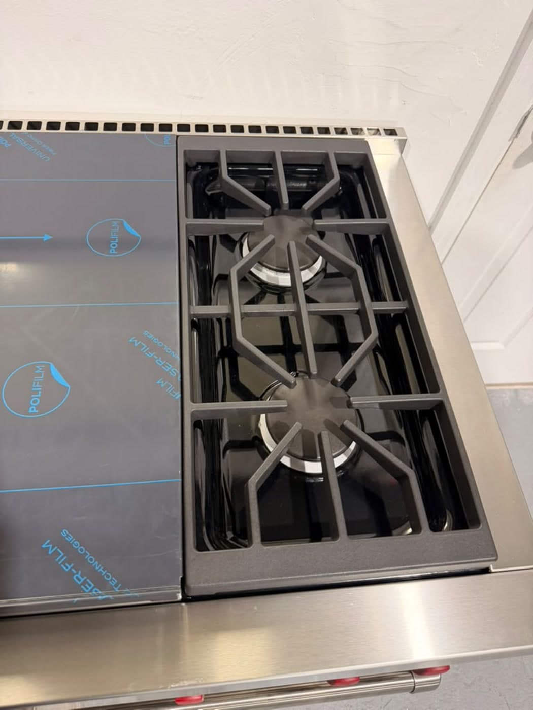 Actual wolf 60-inch professional gas range photographed in Oakland Park — actual wolf range · burner and grate detail