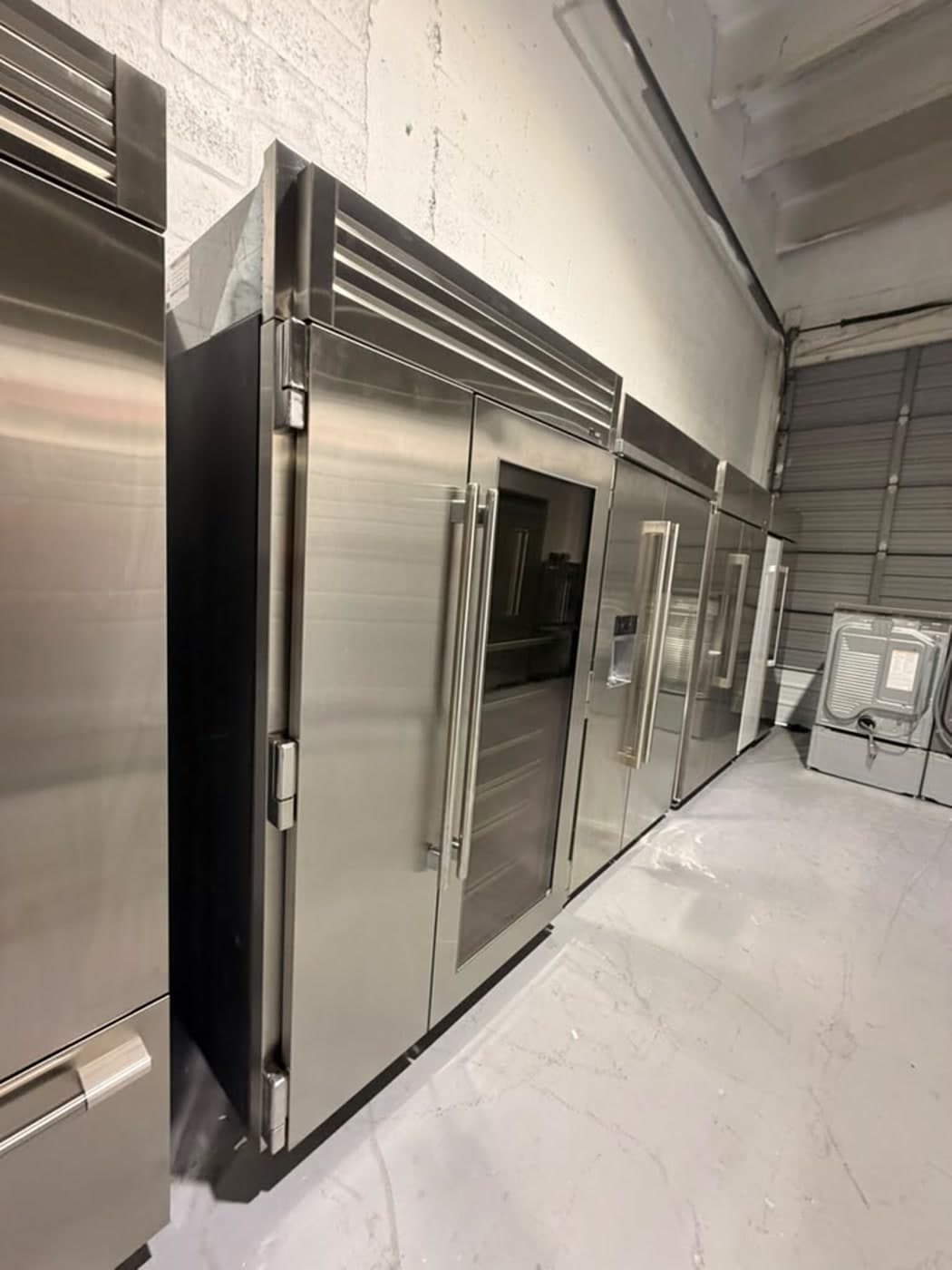 Actual true residential 48-inch glass-door refrigerator photographed in Oakland Park — actual unit · closed side angle