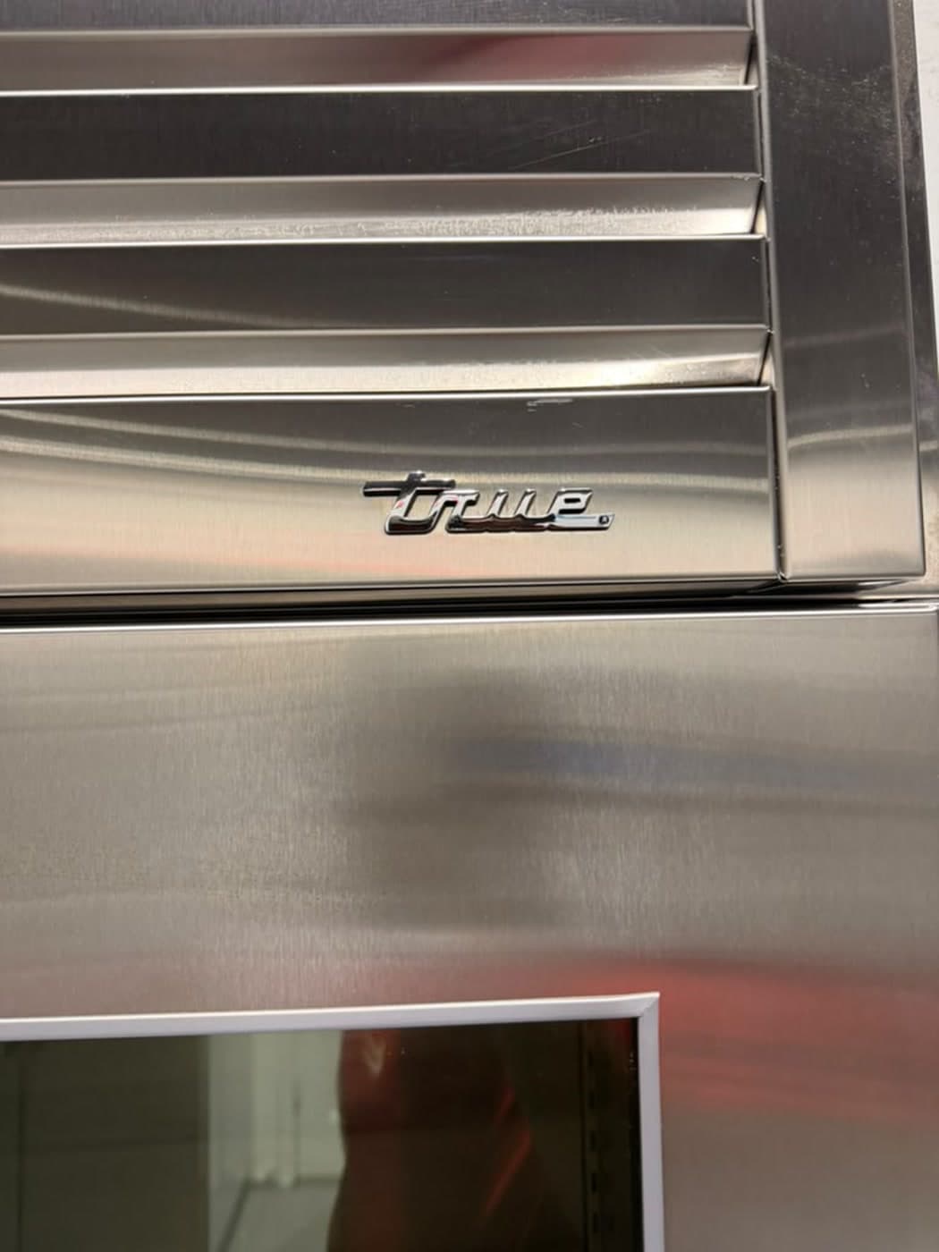 Actual true residential 48-inch glass-door refrigerator photographed in Oakland Park — actual unit · true brand detail