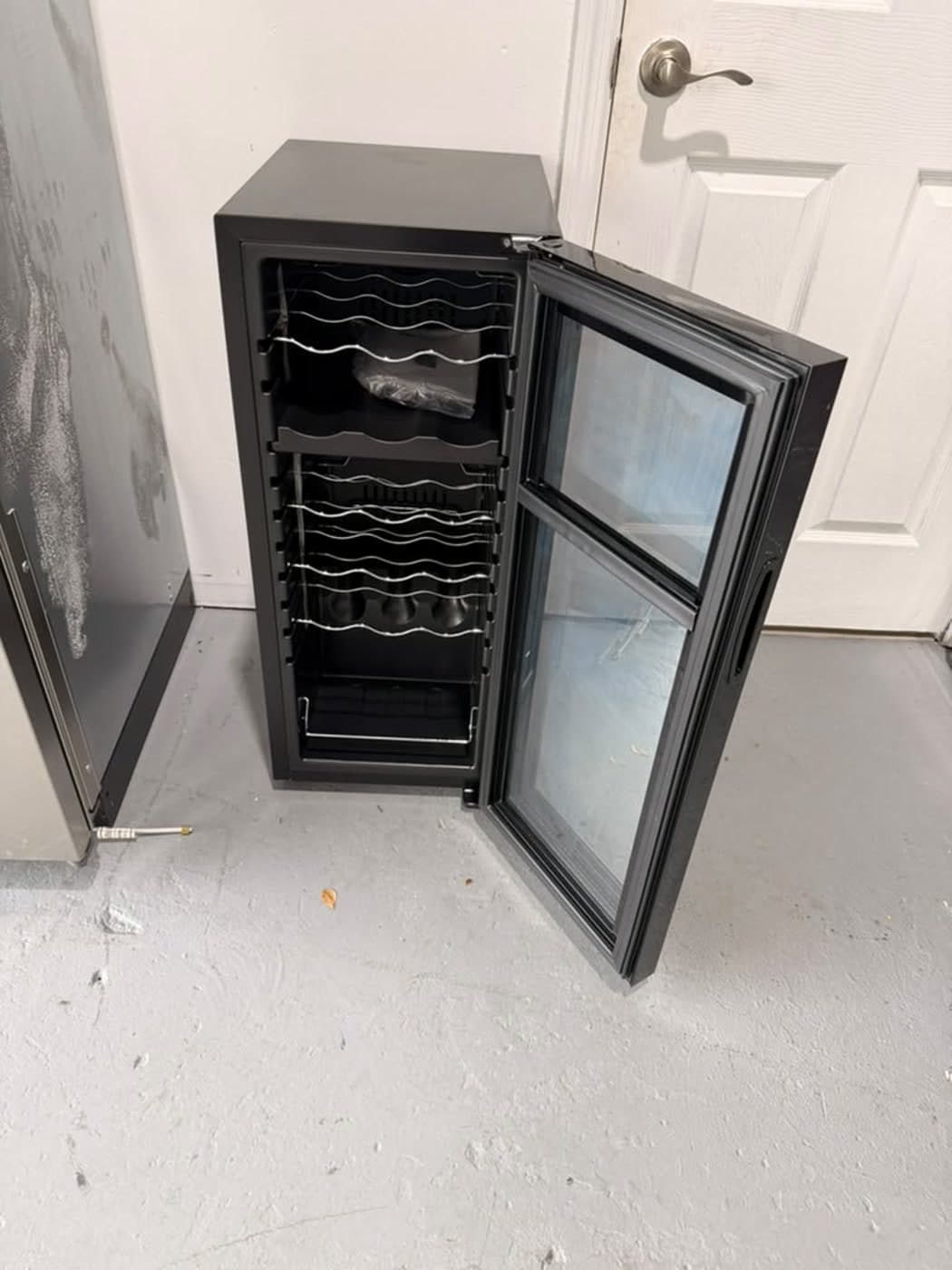 Actual wine enthusiast 18-bottle dual zone wine cooler photographed in Oakland Park — actual unit · open interior