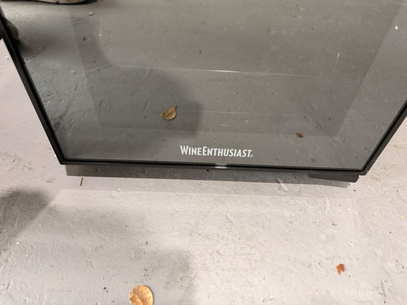 Actual wine enthusiast 18-bottle dual zone wine cooler photographed in Oakland Park — actual unit · brand detail