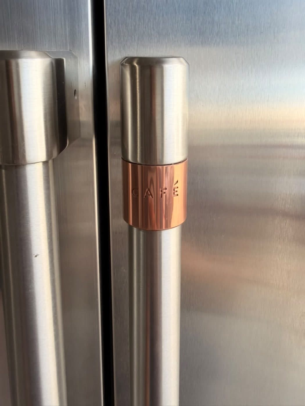 Actual café 48-inch side-by-side refrigerator photographed in Oakland Park — actual unit · café handle detail
